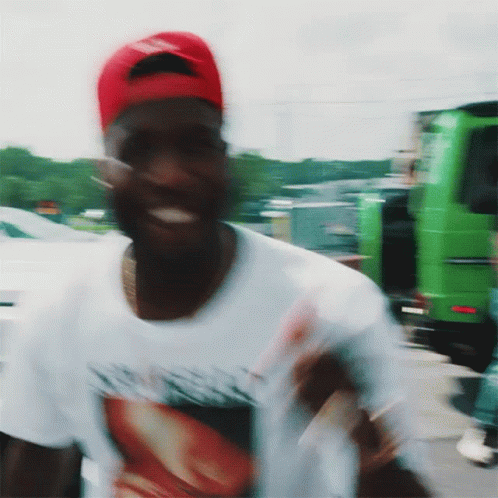 Man in Red Hat and White Shirt