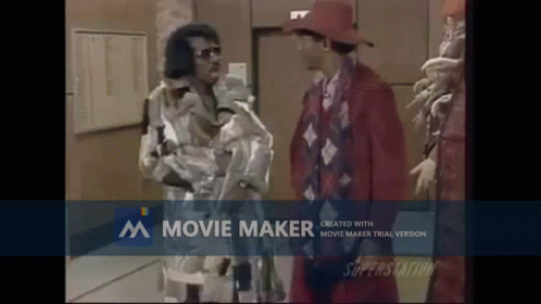 Man in Red Hat Beside Man in Red Suit