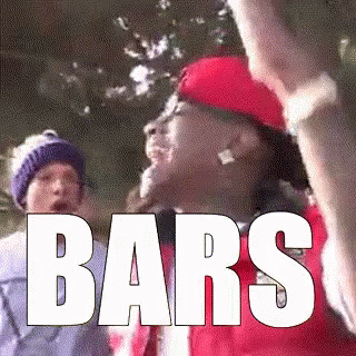 Man In Red Hat Holding Stick With Bars GIF