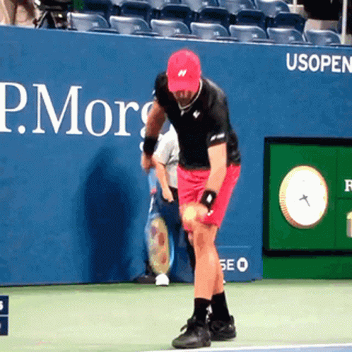 Man in Red Hat Holding Tennis Ball in Front of P. Morrison Advertisement
