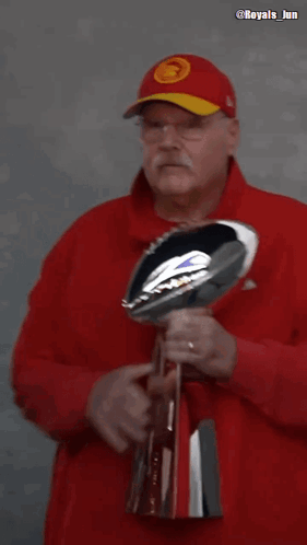 Man in Red Hat Kissing NFL Trophy