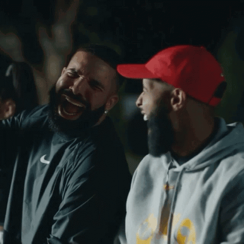 Man In Red Hat Laughing Next To Another Man GIF