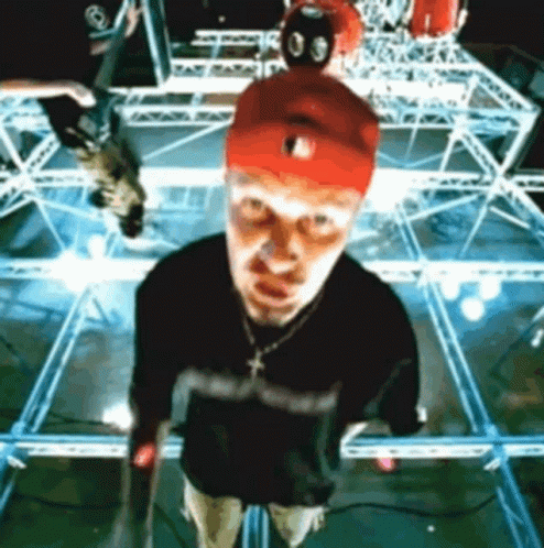 Man In Red Hat On Stage Looking Up GIF