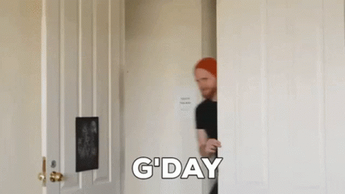 Man in Red Hat Peeking Out of Door