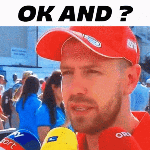 Man In Red Hat Talking Into Microphone GIF