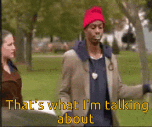 Man in Red Hat Talking to Woman