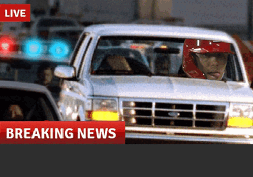 Man in Red Helmet Driving Car Breaking News