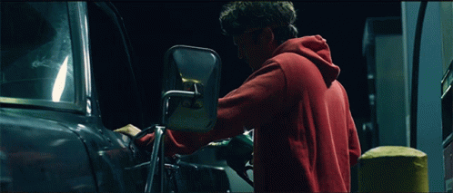 Man In Red Hoodie Adjusting Car Mirror GIF