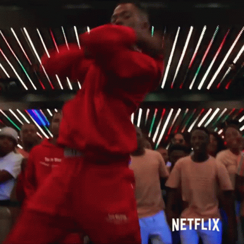 Man in Red Hoodie Dancing with Netflix Logo