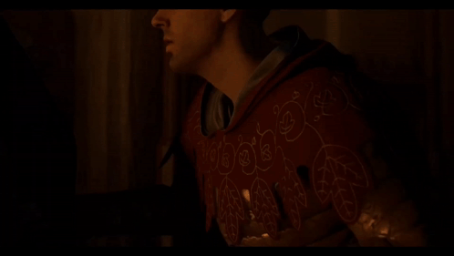 Man In Red Hoodie Holding Candle In Dark GIF