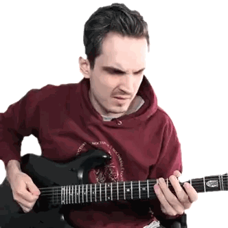 Man in Red Hoodie Playing Guitar