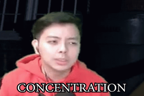 Man In Red Hoodie With Concentration GIF