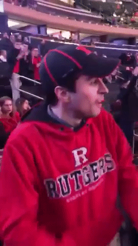 Man in Red Hoodie With Letter R