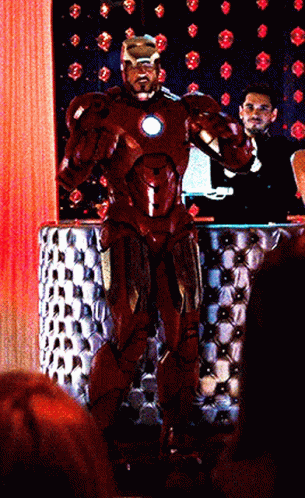 Man In Red Iron Man Suit With Crowd GIF