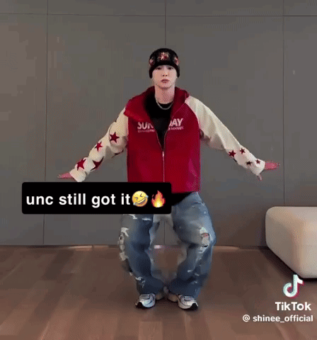 Man in Red Jacket and Beanie Dancing