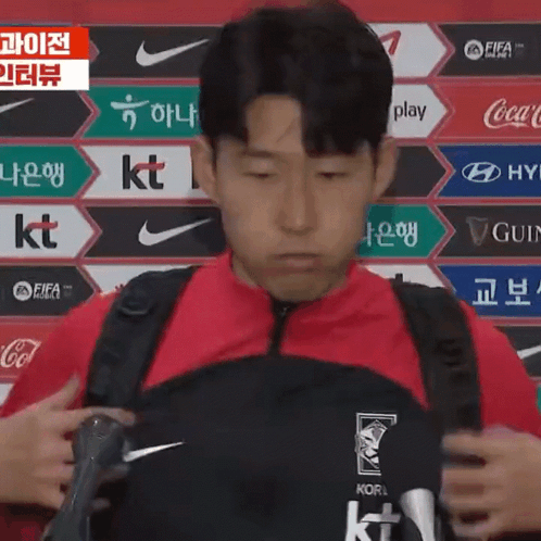 Man in Red Jacket and Black Backpack Korea