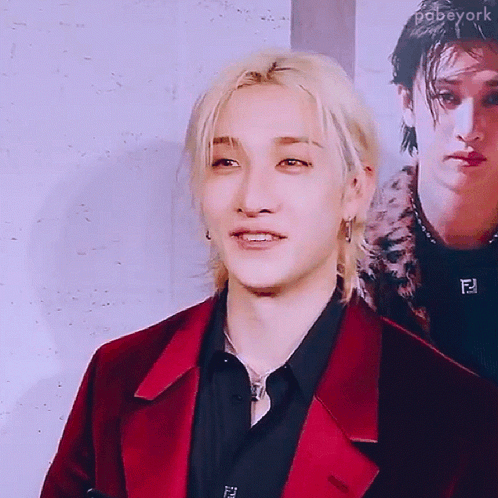 Man In Red Jacket And Black Shirt Smiling GIF