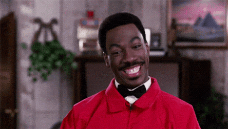 Man in Red Jacket and Bow Tie Smiling