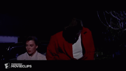 Man in Red Jacket and Woman in White Coat