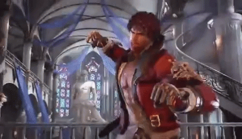 Man in Red Jacket by Stained Glass Window
