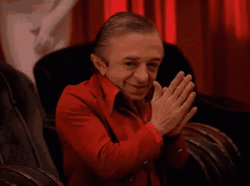 Man in Red Jacket Clapping