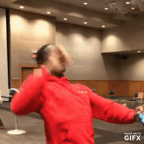 Man in Red Jacket Dancing Gifx Watermark