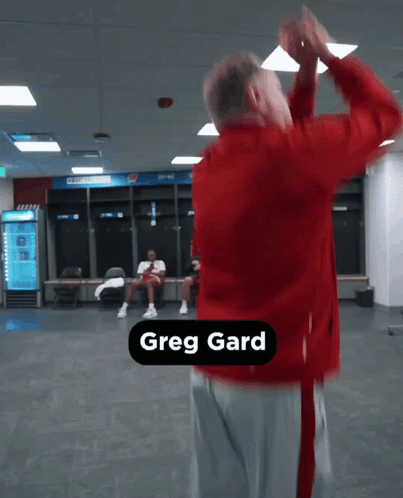 Man in Red Jacket Dancing Greg Gard