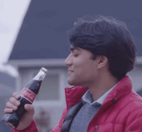 Man In Red Jacket Drinking Coca Cola GIF