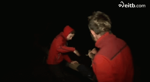 Man in Red Jacket Held by Person eitb.com