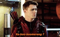 Man in Red Jacket Holding Arrow Says Ka-Boo-Boomerang