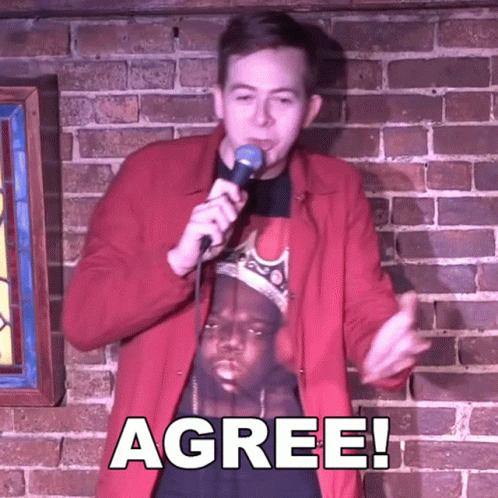 Man In Red Jacket Holding Microphone GIF