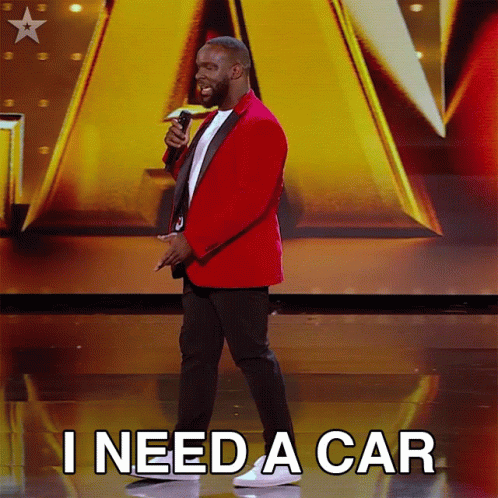 Man in Red Jacket Holding Microphone Says I Need a Car