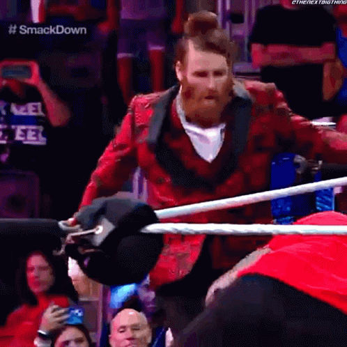 Man in Red Jacket in Wrestling Ring
