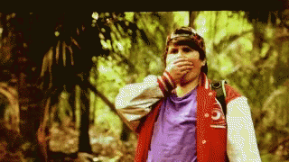 Man In Red Jacket Number 5 Covering Mouth GIF