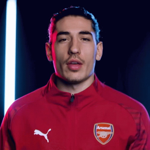 Man in Red Jacket Saying Arsenal