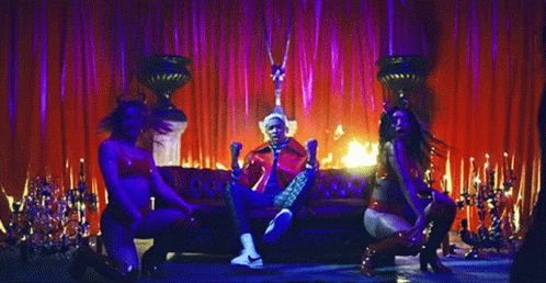 Man In Red Jacket Sitting By Fire GIF