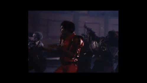Man in Red Jacket Surrounded by Zombies