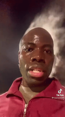 Man in Red Jacket Sweating and Crying