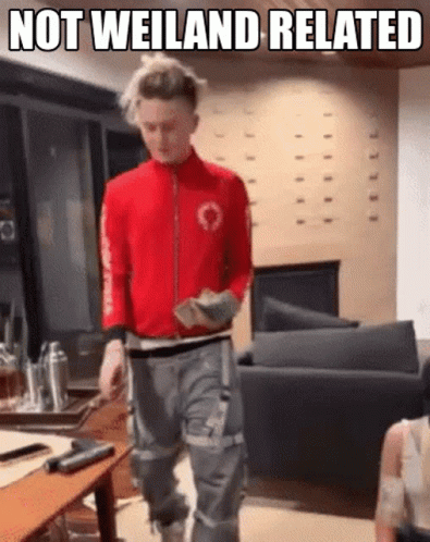 Man in Red Jacket Walking Living Room Not Weiland Related