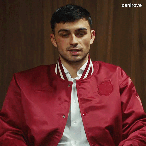 Man in Red Jacket with Canirove