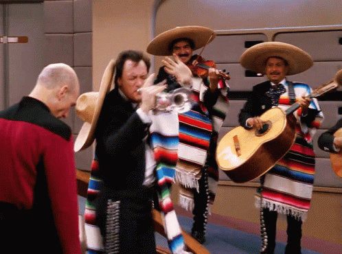 Man in Red Jacket with Mariachi Musicians