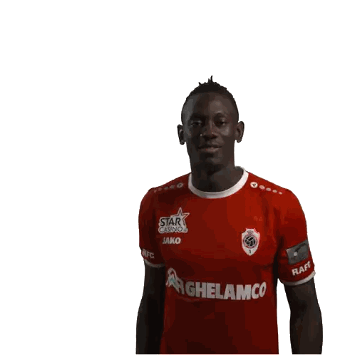 Man in Red Jako Shirt Saluting