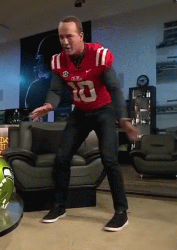 Man in Red Jersey Number 10 Dancing