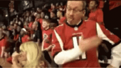 Man In Red Jersey Number 21 Dancing In Crowd GIF