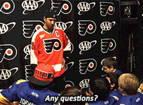 Man in Red Jersey Number 8 Asking Kids Questions