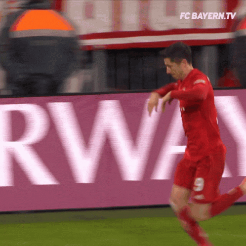 Man in Red Jersey Number 9