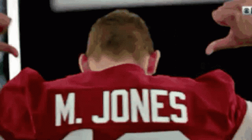 Man in Red Jersey Saying M. Jones