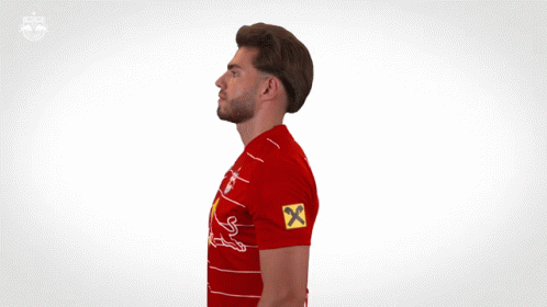 Man in Red Jersey With Bull