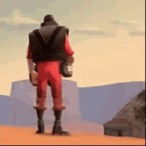 Man in Red Jumpsuit Holding Water in Desert