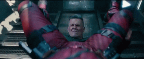 Man In Red Jumpsuit Lying On Back GIF